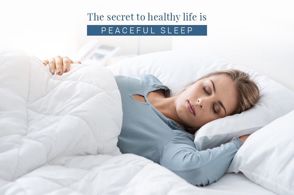Peaceful sleeper on Pizuna cotton bedding used for a relaxation and sleep improvement guide.